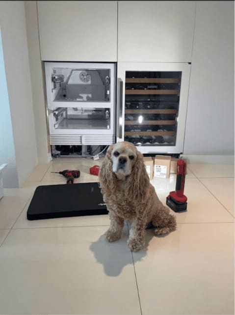 Sub-Zero ice maker and wine cooler column mid-repair by a local Miami technician in a family home — Brickell same-day service call
