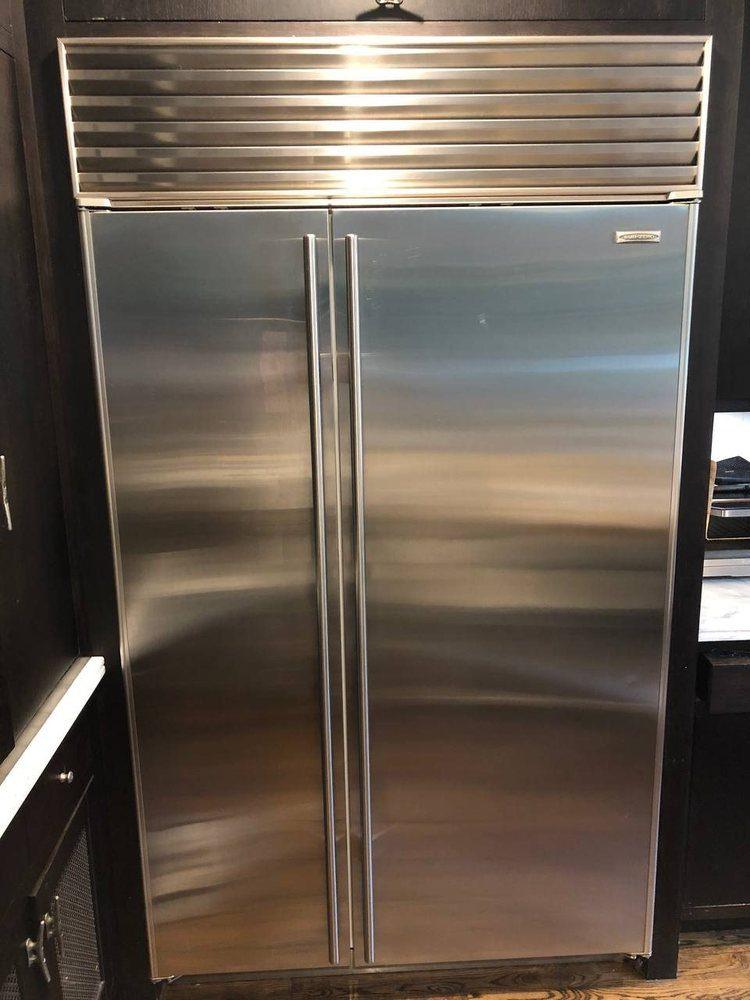 Stainless Sub-Zero built-in refrigerator serviced in a Miami kitchen