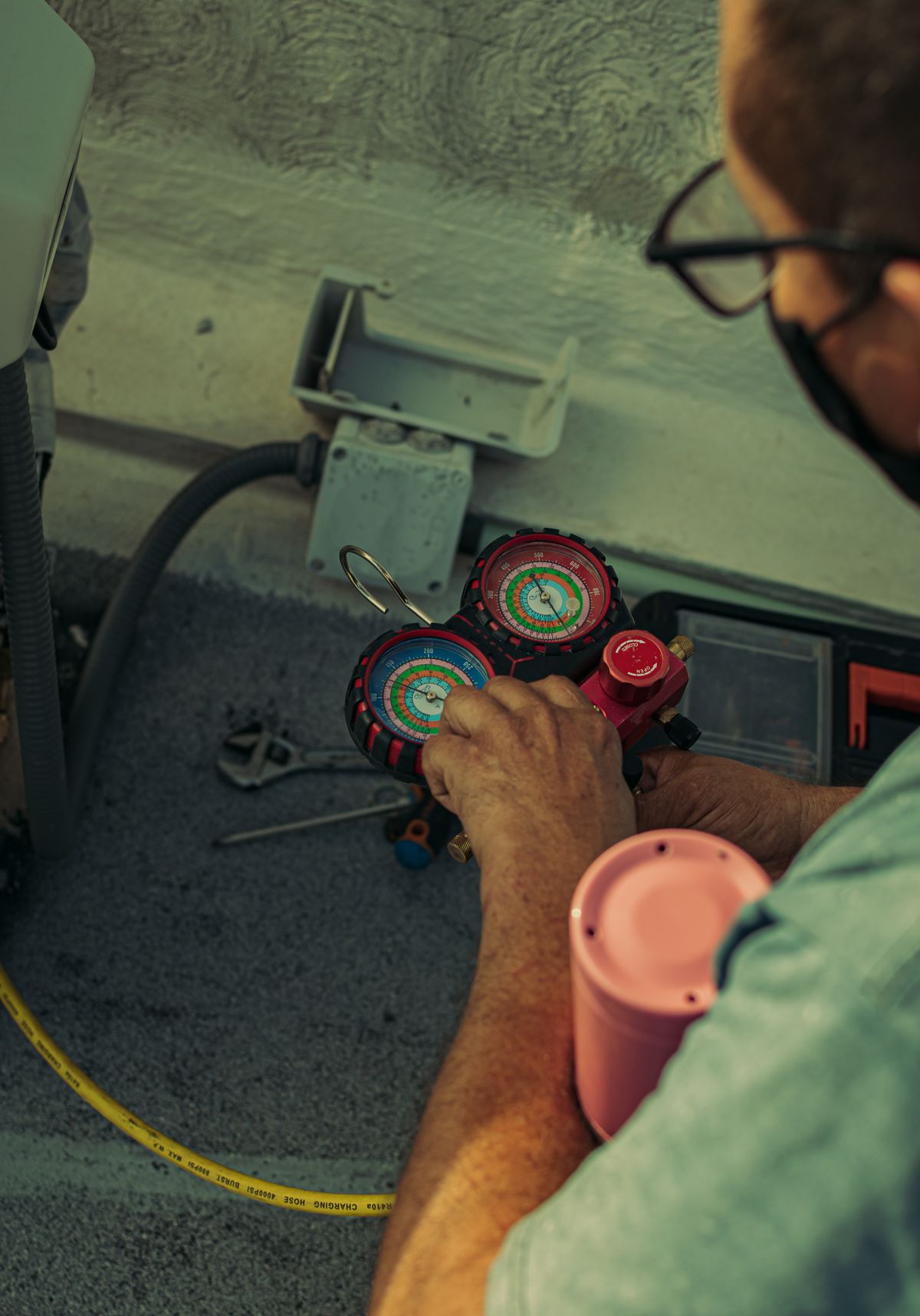 Refrigerant gauges connected during a Sub-Zero service visit in Miami